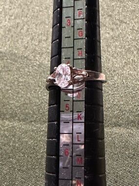 Vintage sterling silver adjustable ring with bright clear stone.